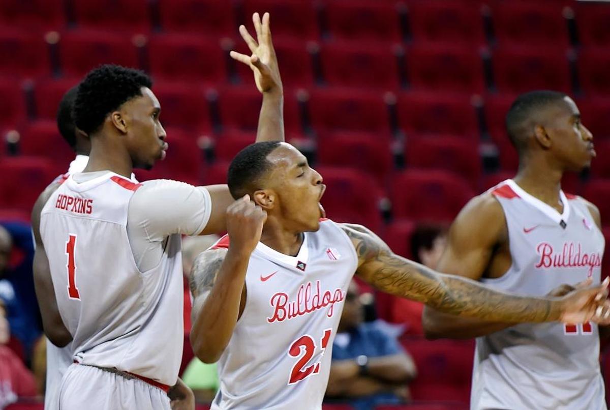 Fresno State’s Jaron Hopkins (1), Deshon Taylor (21) and Bryson Williams, right, yell from the sidelines as the Bulldogs routed Pacific Union College 99-56 in an exhibition game Monday night, Oct. 30, 2017 in Fresno.