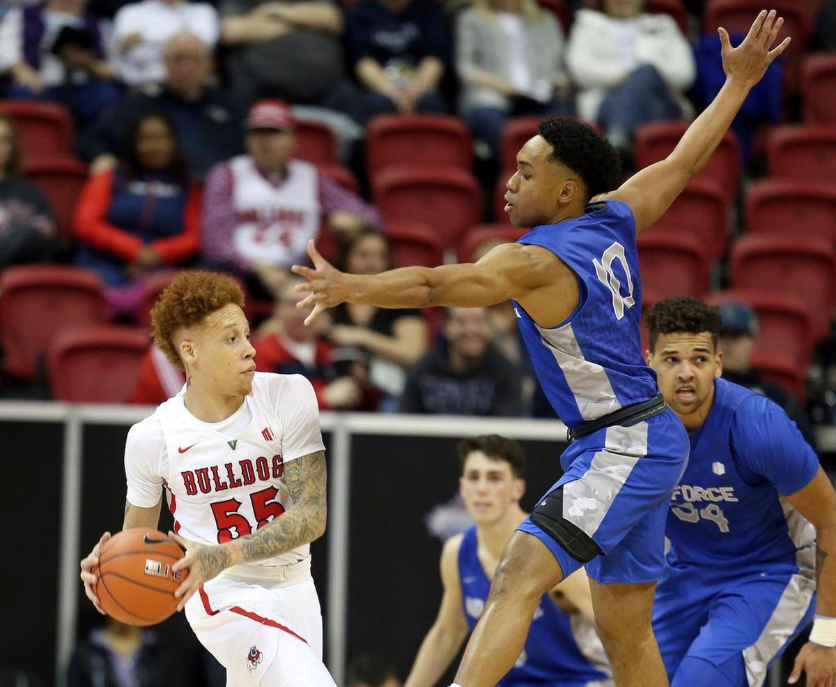 Fresno State’s Noah Blackwell (55) looks to pass the ball as Air Force’s AJ Walker (10) defends during the first half of an NCAA college basketball game in the Mountain West Conference men’s tournament Thursday, March 14, 2019, in Las Vegas. (AP Photo/Isaac Brekken)