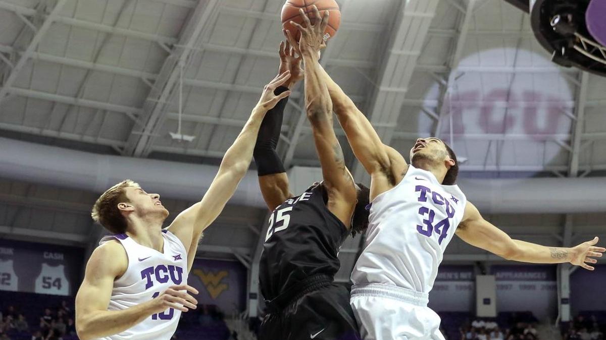 TCU guard Kenrich Williams, left, and forward Vladimir Brodziansky go for a loose ball against Kansas State guard Wesley Iwundu during a Big 12 game March 1, 2017 at Schollmaier Arena.