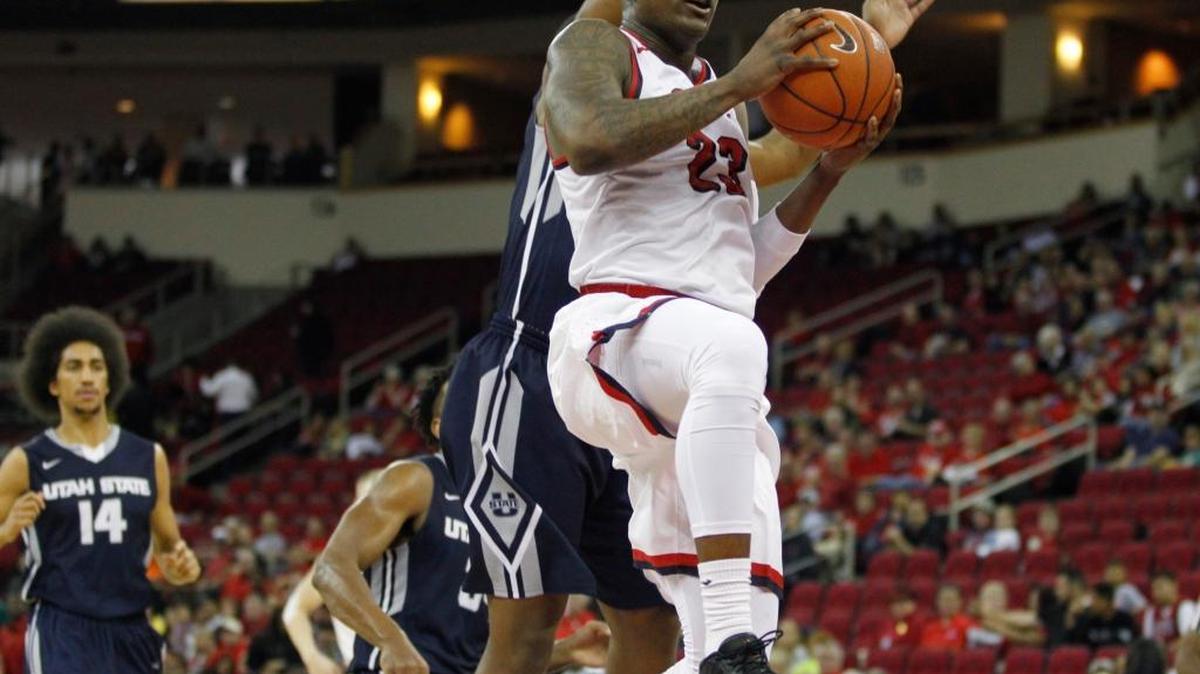 Fresno State’s Marvelle Harris goes in for a layup after a steal against Utah State during Saturday’s Mountain West Conference game at Save Mart Center. Harris scored 22 points as the Bulldogs won 75-68.