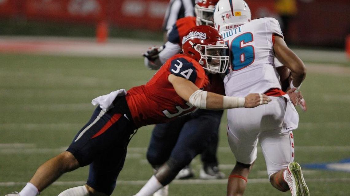 Fresno State linebacker George Helmuth wraps up New Mexico quarterback Tevaka Tuioti during the second half of a 38-0 victory in Fresno, Saturday, Oct. 14, 2017. The Bulldogs’ defense has allowed Mountain West Conference opponents to score a touchdown on only five of 11 trips into the red zone.