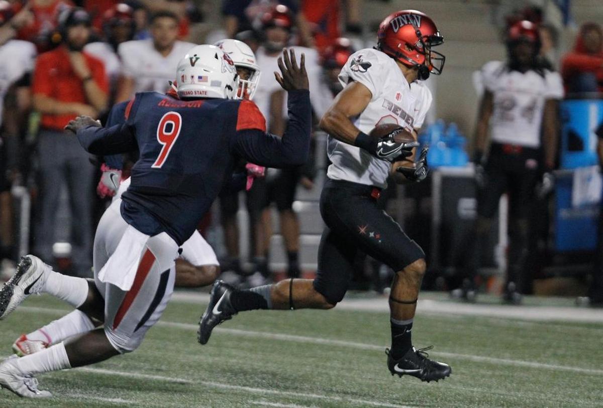 Fresno State linebacker Jeffrey Allison chases down UNLV’s Brandon Presley during the second half of the Bulldogs’ 26-16 loss Saturday. Allison had eight tackles in the game, the fifth time in eight games this season the Bulldogs’ linebacker has had eight or more.