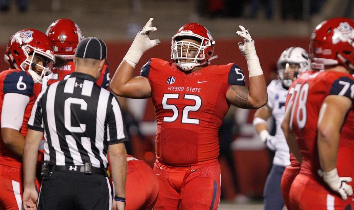 Fresno State left guard Netane Muti celebrates after a Bulldogs score in a 20-13 victory over BYU, Saturday, Nov. 4, 2017. The Bulldogs’ offensive line has allowed only six sacks this season and 32.0 tackles for loss and is first in the Mountain West in both statistical categories.