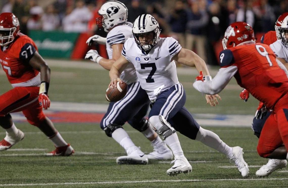 BYU quarterback Beau Hoge tries to avoid Fresno State linebacker Jeffrey Allison, right, during the first half of the Bulldogs’ 20-13 victory at Bulldog Stadium on Saturday, Nov. 4, 2017. Allison led another stellar effort by the Fresno State defense, racking up a game-high 14 tackles.