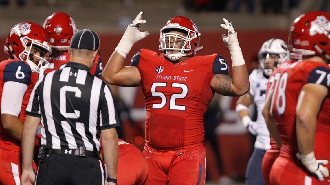 Fresno State guard Netane Muti celebrates after the Bulldogs scored a touchdown in a 20-13 victory over BYU, Saturday, Nov. 4, 2017. Muti, a redshirt freshman, has been a key cog in an offensive line that has paved the way for an offense that is averaging 29.0 points per game after averaging just 17.7 last season.
