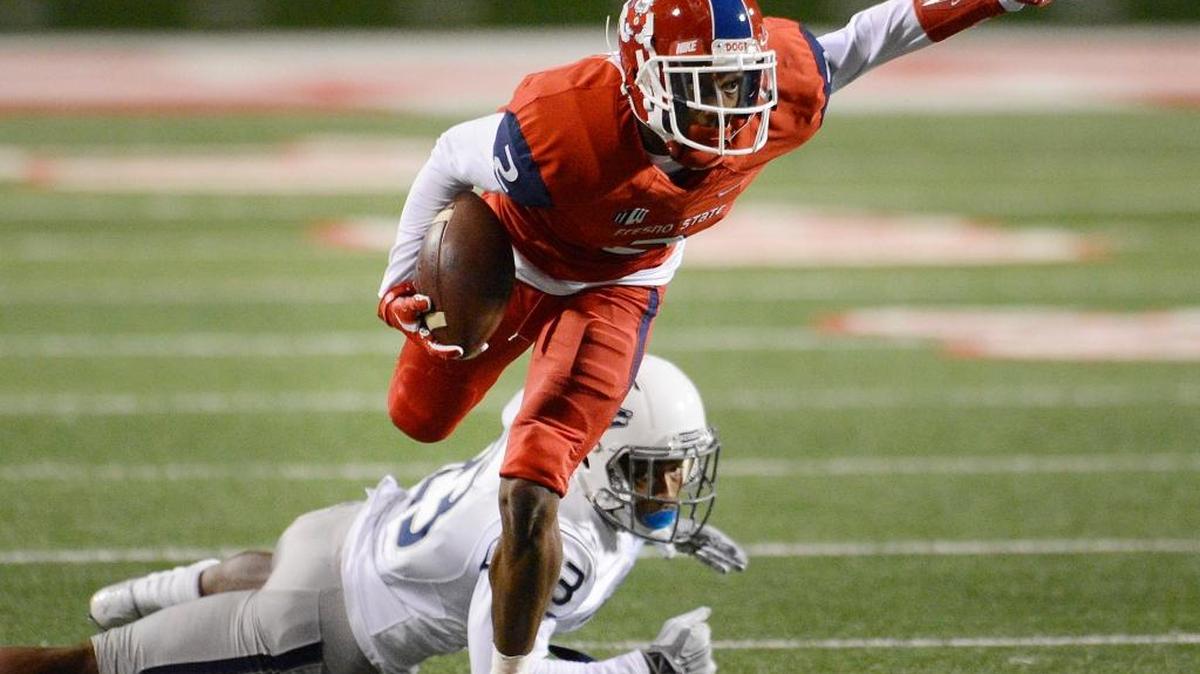 Fresno State’s Jamire Jordan breaks away from Nevada’s Dameon Baber in their Nov. 5 game at Bulldog Stadium. Jordan finished with three catches for 50 yards in the Bulldogs’ 30-16 loss.
