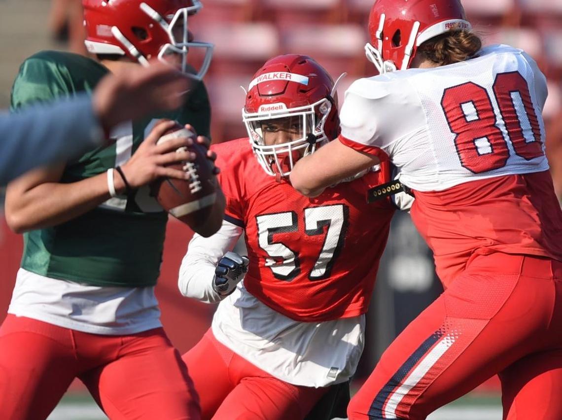 Fresno State defensive end Mykal Walker tries to get past tight end Gunner Javernick and to quarterback Jorge Reyna during a Hawaii Bowl practice, Friday Dec. 15, 2017. Walker could be a key piece to the Bulldogs’ defensive line this season as it tries to replace four seniors from the team that went 10-4 a year ago.
