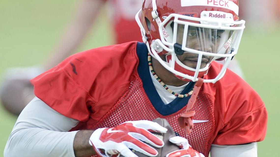 
Fresno State’s Aaron Peck catches passes during the first practice of fall camp on Aug. 6, 2015. Peck – the Bulldogs’ top returning receiver with 32 catches for 419 yards – needs surgery for a left foot injury and will miss the entire season.
