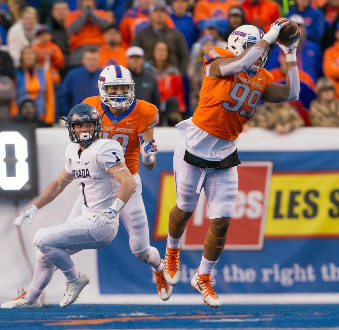 Boise State defensive end Curtis Weaver intercepts a pass during the Broncos’ 41-14 victory over Nevada in early November. Weaver is tied for the Mountain West lead is sacks with 8.0.