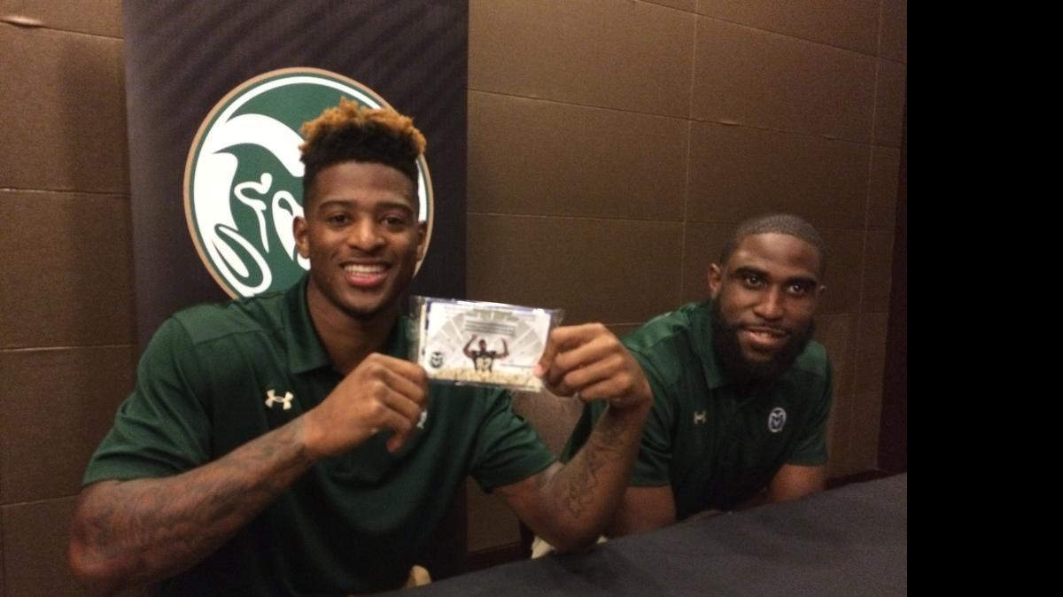 
Colorado State receiver Rashard Higgins, the Mountain West Conference Preseason Offensive Player of the Year, shows off his own brand of Hollywood popcorn during Wednesday’s interview session in Las Vegas. Safety Trent Matthews looks on..
