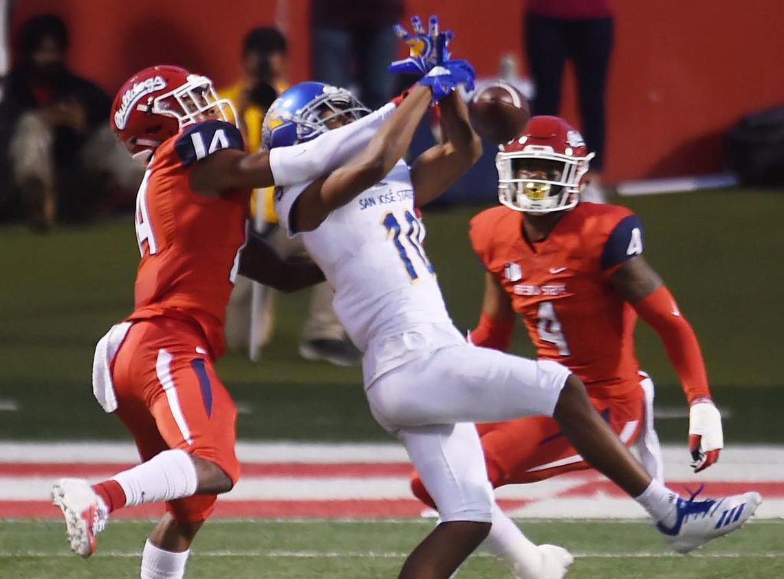 Fresno State cornerback Jaron Bryant, left, breaks up a pass intended for San Jose State receiver JaQuan Blackwell, center, in the Bulldogs’ 31-13 victory over the Spartans Saturday, Nov. 24, 2018 in Fresno.