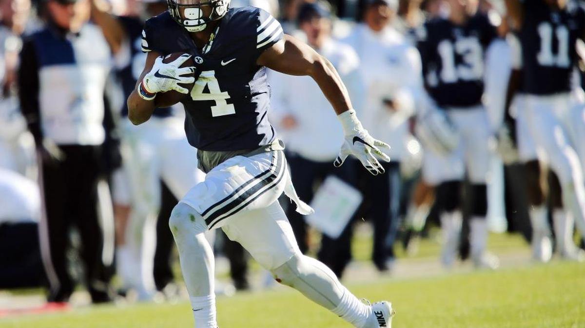 Brigham Young linebacker Fred Warner runs back an interception against Fresno State during Saturday’s game in Provo, Utah. It was one of three interceptions for the Cougars, who rolled to a 52-10 win.