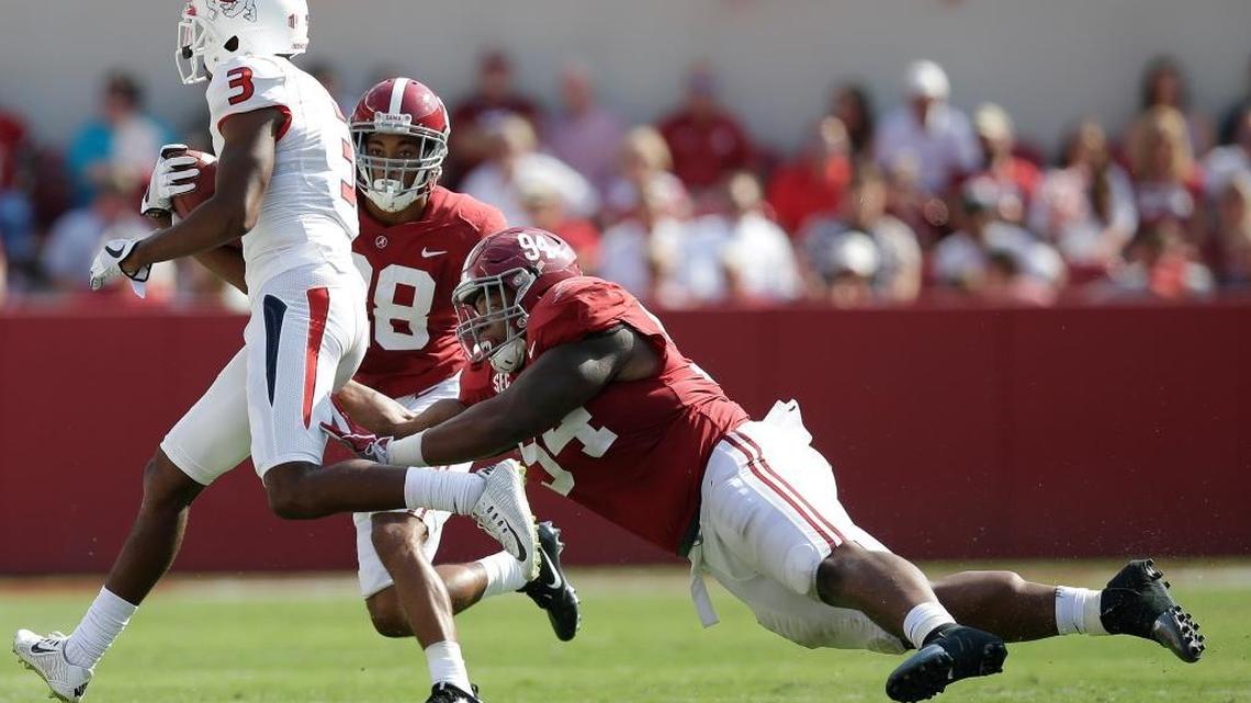 Alabama defensive lineman Da’Ron Payne tackles Fresno State wide receiver KeeSean Johnson in the first half Saturday, Sept. 9, 2017, in Tuscaloosa. Johnson’s eight receptions were two off a career high set in 2016 against Air Force.