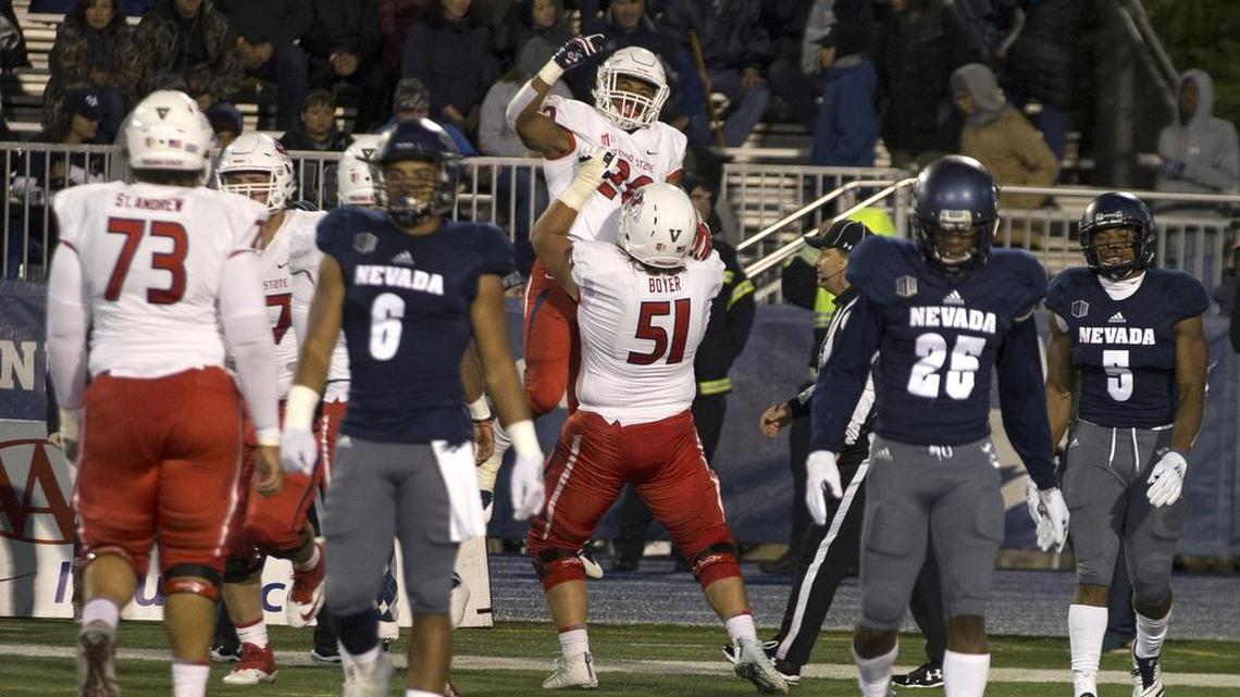 Outstanding play the past two seasons from centers including Markus Boyer, seen celebrating a touchdown with running back Ronnie Rivers, has helped Fresno State’s offense elevate the past two seasons.