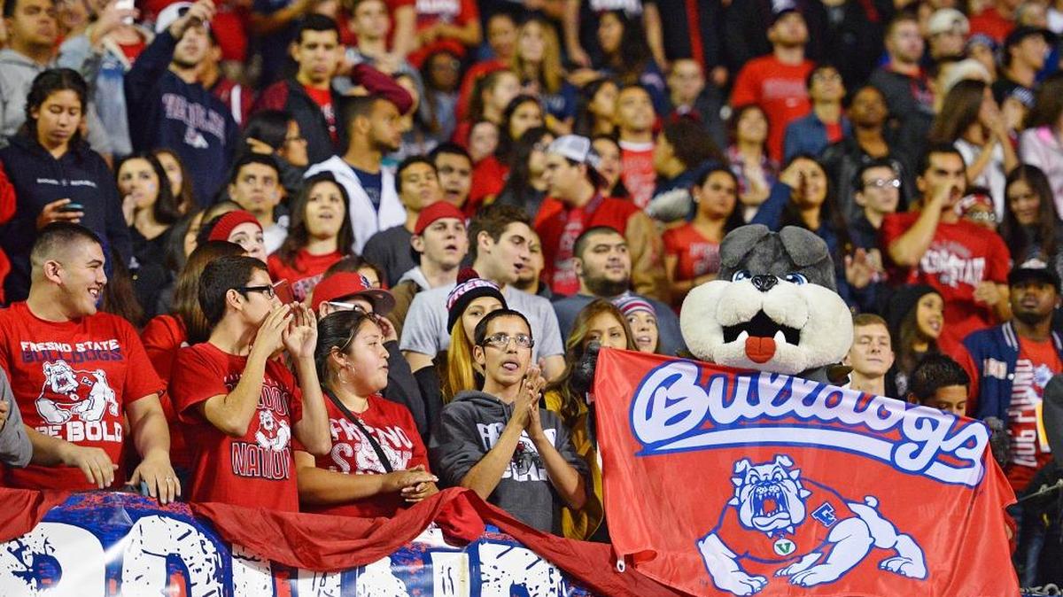 Fresno State football fans cheer for the Bulldogs during their game against San Jose State in 2014, when the program sold 25,082 season tickets.