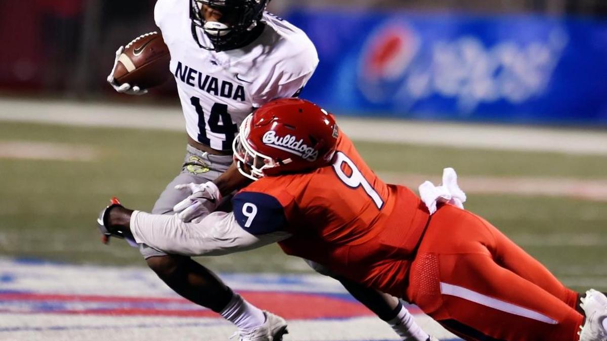 Fresno State linebacker Jeffrey Allison, right, tackles Nevada's Mar'Quette Jackson, left, Saturday, Sept. 30, 2017 in Fresno. Allison, the Bulldogs’ leading tackler, had eight more tackles in a 41-21 victory over the Wolf Pack.
