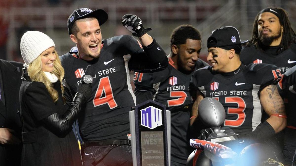 Fresno State quarterback Derek Carr is interviewed at the podium after the Bulldogs won their Mountain West Conference championship game against Utah State at Bulldog Stadium Saturday, December 7, 2013. Carr is hoping the 2017 Bulldogs will do the same.