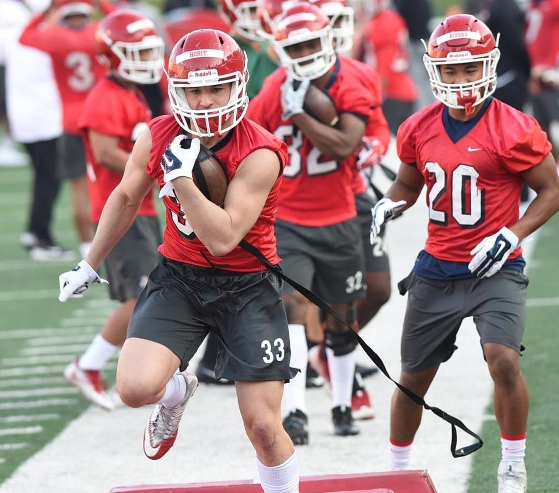 Fresno State running back Josh Hokit runs a drill with teammates including Ronnie Rivers (20) during the first spring practice, March 12, 2018. The Bulldogs return their top five running backs from last season and Washington State transfer Romello Harris also is eligible to play this season in a crowded backfield.
