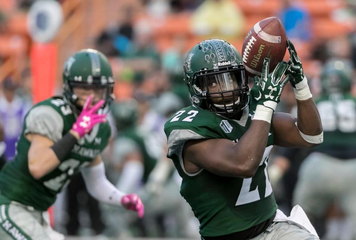 Hawaii running back Diocemy Saint Juste (22) catches a pass in the first quarter of a 28-7 loss to San Diego State, Saturday, Oct. 28, 2017, in Honolulu. Saint Juste is ranked second in the Mountain West in rushing, averaging 138.3 yards per game. He also is averaging 24.4 carries per game, most in the conference.