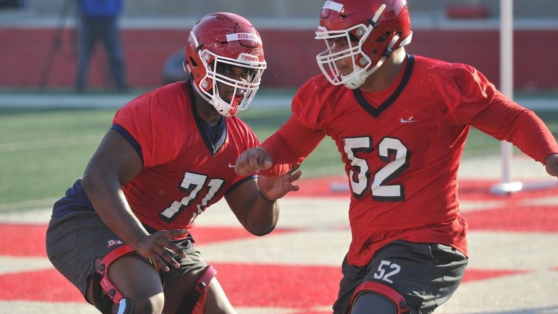 Fresno State offensive linemen Marc-David Bien-Amie, left, and Netane Muti run a drill during the first spring practice, Monday morning, March 12, 2018. Bien-Amie has moved to right tackle from right guard in fall camp, a move line coach Ryan Grubb said better fits the 6-foot-5, 350-pound freshman.