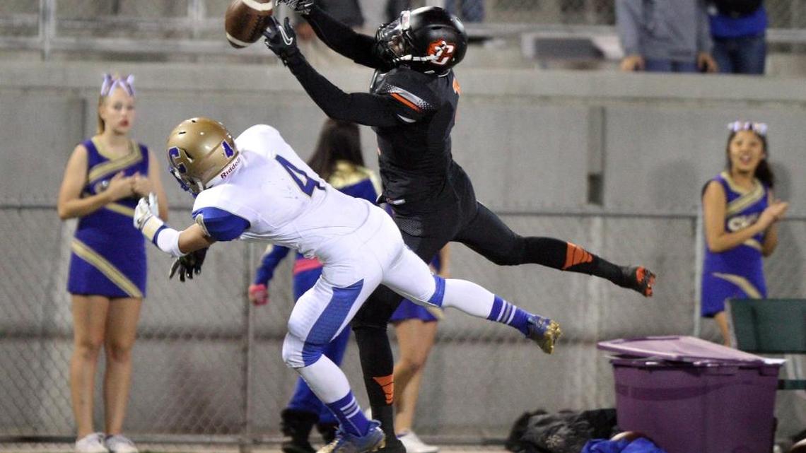 Fresno State cornerback Johnny Johnson is a graduate transfer from UCLA. Before that, Johnson was a star at Central High, as seen, right, breaking up a pass to Clovis High's McKay France in an October 2012 game.