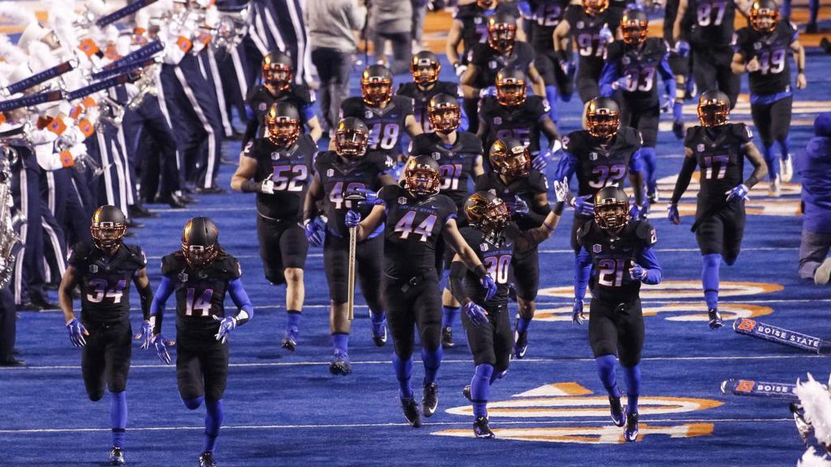 Boise State linebacker Darren Lee (44) carries the hammer onto the field at Albertsons Stadium with his teammates before their game against New Mexico on on Saturday, Nov. 14, 2015. Boise State led the Mountain West this season in TV appearance bonuses, earning $1.6 million.
