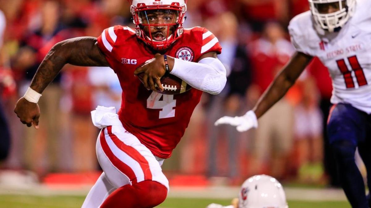 Nebraska quarterback Tommy Armstrong Jr. runs for a touchdown as Fresno State defensive back DeShawn Potts tries to pursue in the second half of Saturday night’s game in Lincoln. Armstrong ran for two touchdowns and threw for another in a 43-10 season-opening victory.