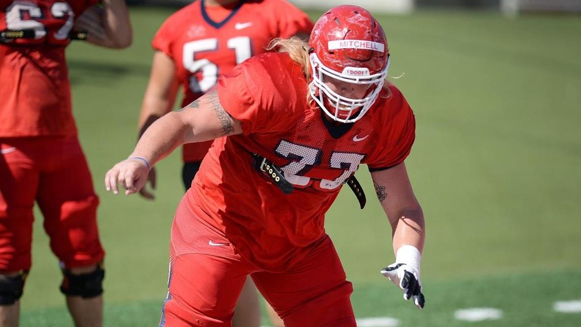 Fresno State center Aaron Mitchell runs through a drill in fall camp. Mitchell and the Bulldogs’ offensive line are leading the Mountain West Conference in tackles for loss allowed (36.0) and sacks allowed (7.0)