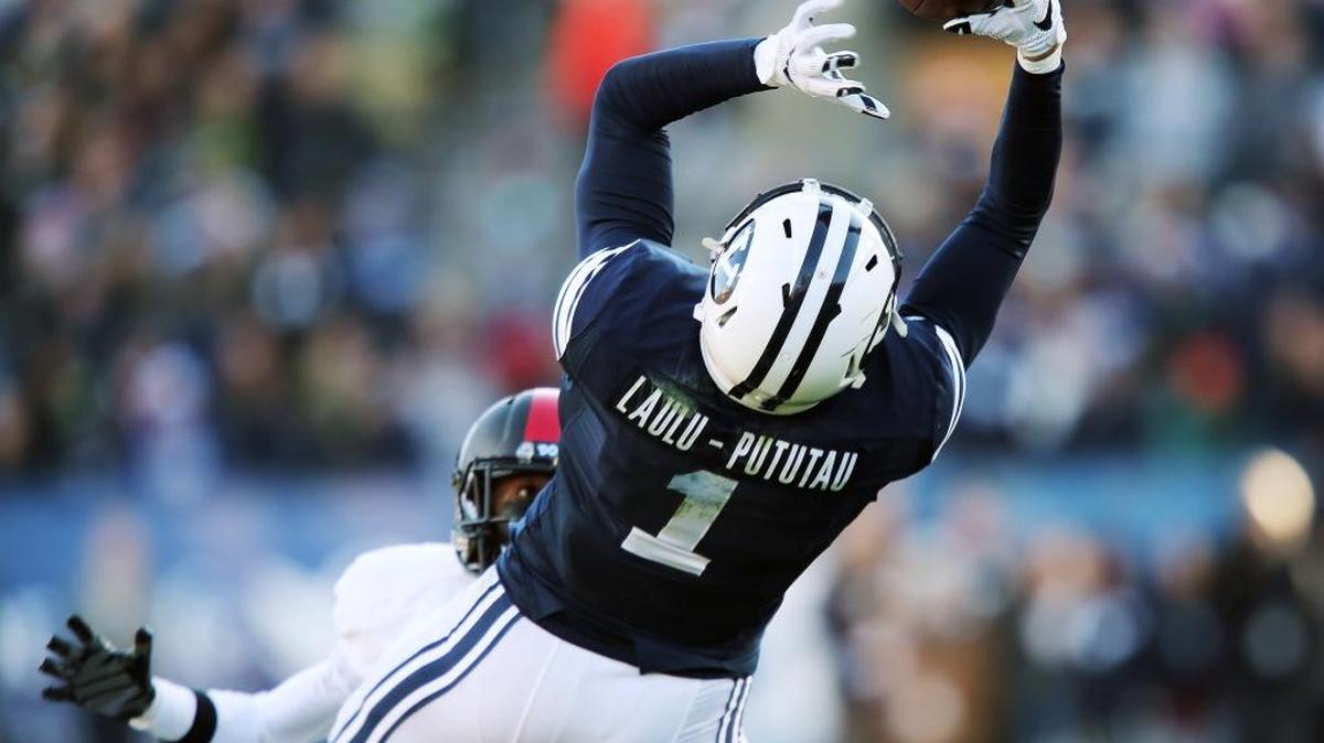 BYU's Moroni Laulu-Pututau grabs a long pass against Fresno State during game in Provo, Utah, Saturday, Nov. 21, 2015.