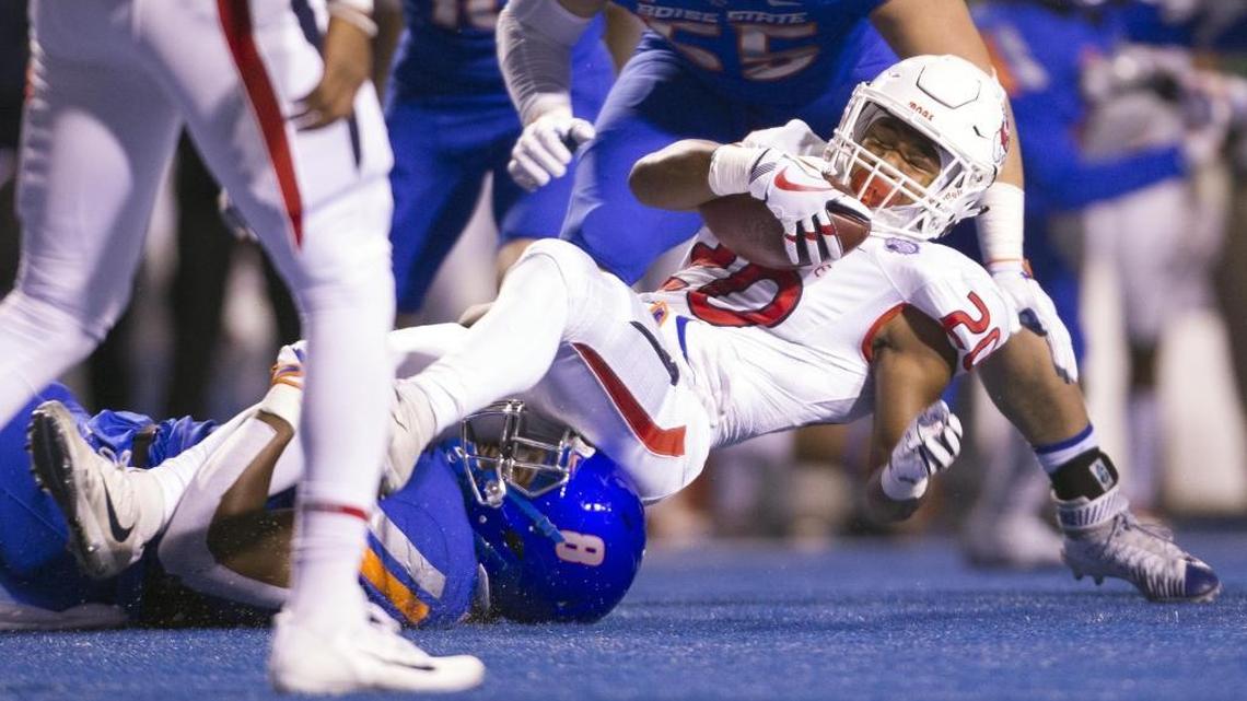 Fresno State running back Ronnie Rivers is tackled by Boise State defensive end Jabril Frazier in the Broncos’ 17-14 victory in the Mountain West Conference Championship Saturday, Dec. 2, 2017 at Albertsons Stadium in Boise.