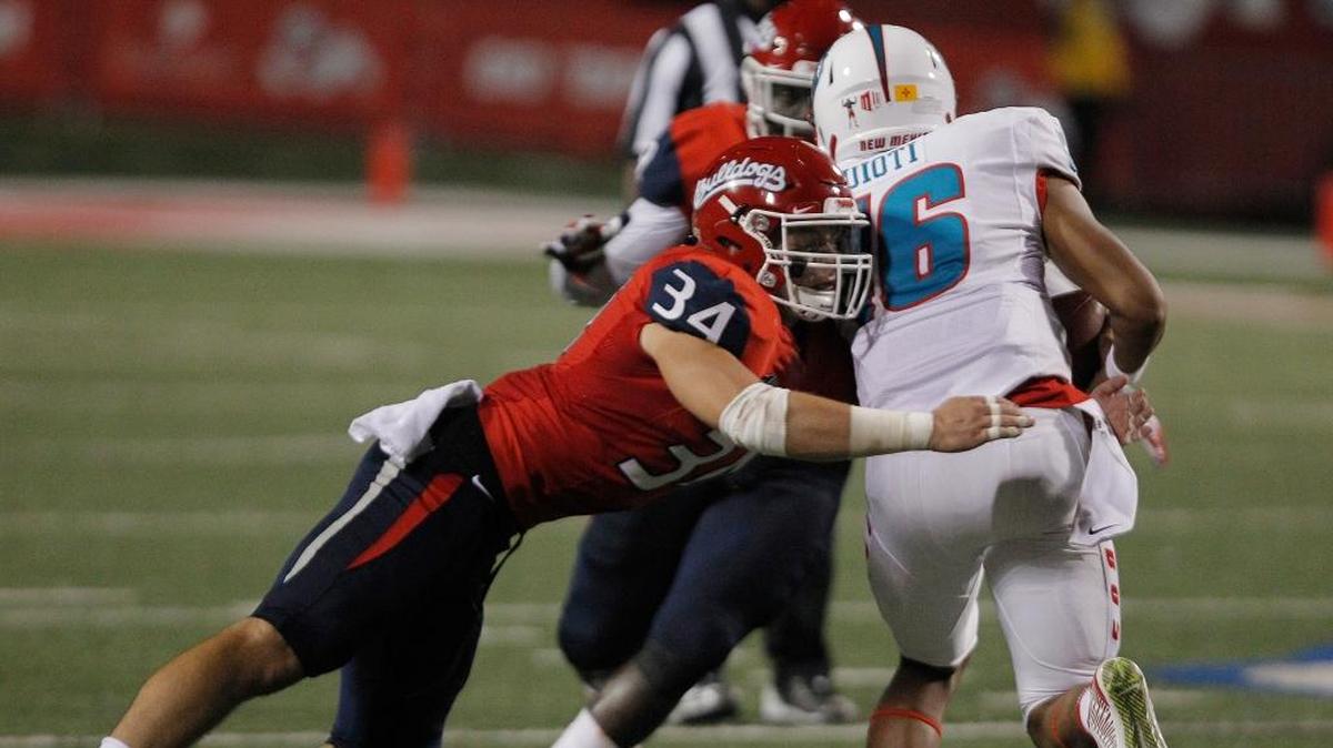 Fresno State linebacker George Helmuth wraps up New Mexico quarterback Tevaka Tuioti in the Bulldogs’ 38-0 victory on Saturday, Oct. 14. Helmuth, a Clovis North grad, was in on five tackles in the victory and is third on the team with 30 tackles including 18 solo stops. Helmuth this season also has 3.0 tackles for loss and 2.0 sacks.