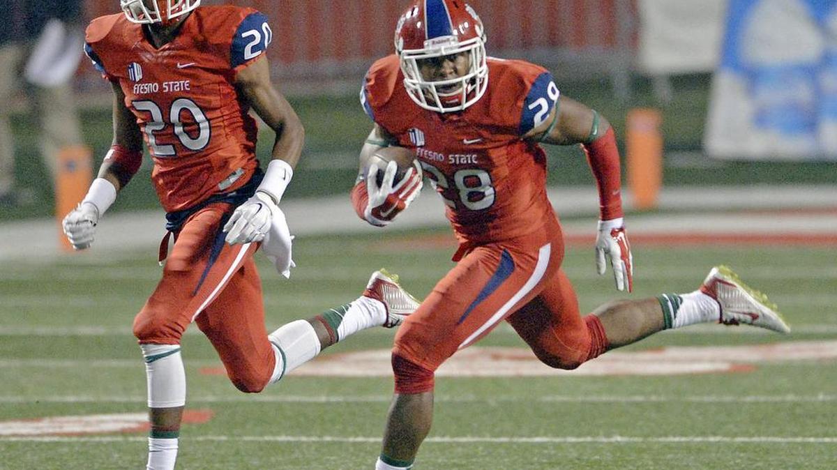 
Fresno State’s Charles Washington, right, makes a long return with blocking from Malcolm Washington after intercepting the ball against San Jose State on Nov. 8, 2014.
