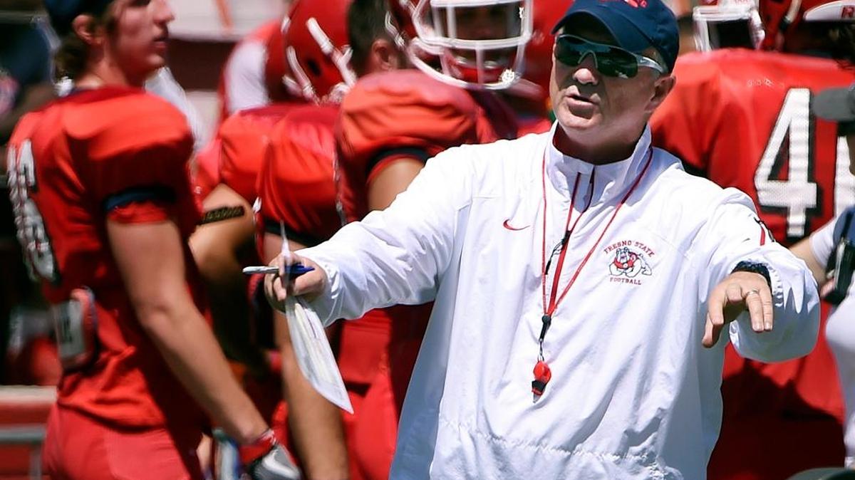 Fresno State coach Jeff Tedford, center, calls out instructions during the Bulldogs Spring Preview at Bulldog Stadium, Saturday, April 29, 2017 in Fresno, Calif. The Bulldogs’ coach, who inherited a Cal team that went 1-10 in 2001 and won seven games in his first season in Berkeley, is one reason Las Vegas bookmakers can see Fresno State rebounding from a 1-11 season a year ago.