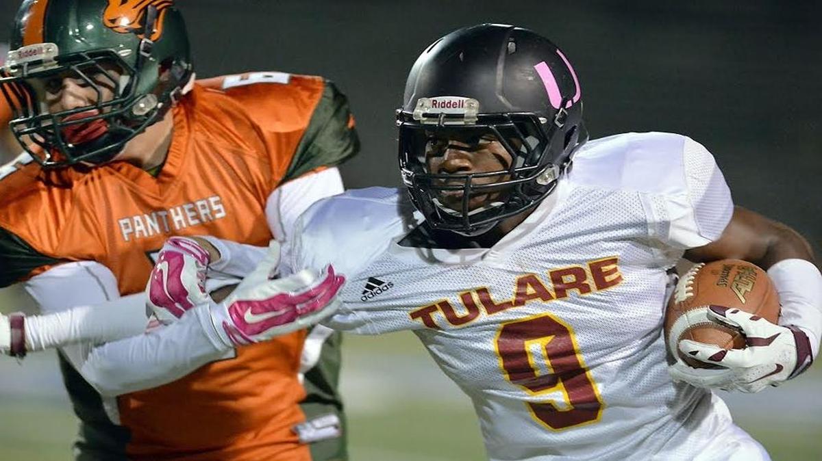 Tulare High wide receiver Emoryie Edwards, right, carries the ball past Porterville’s Justin Duran in a 2015 game. Edwards has committed to Fresno State.