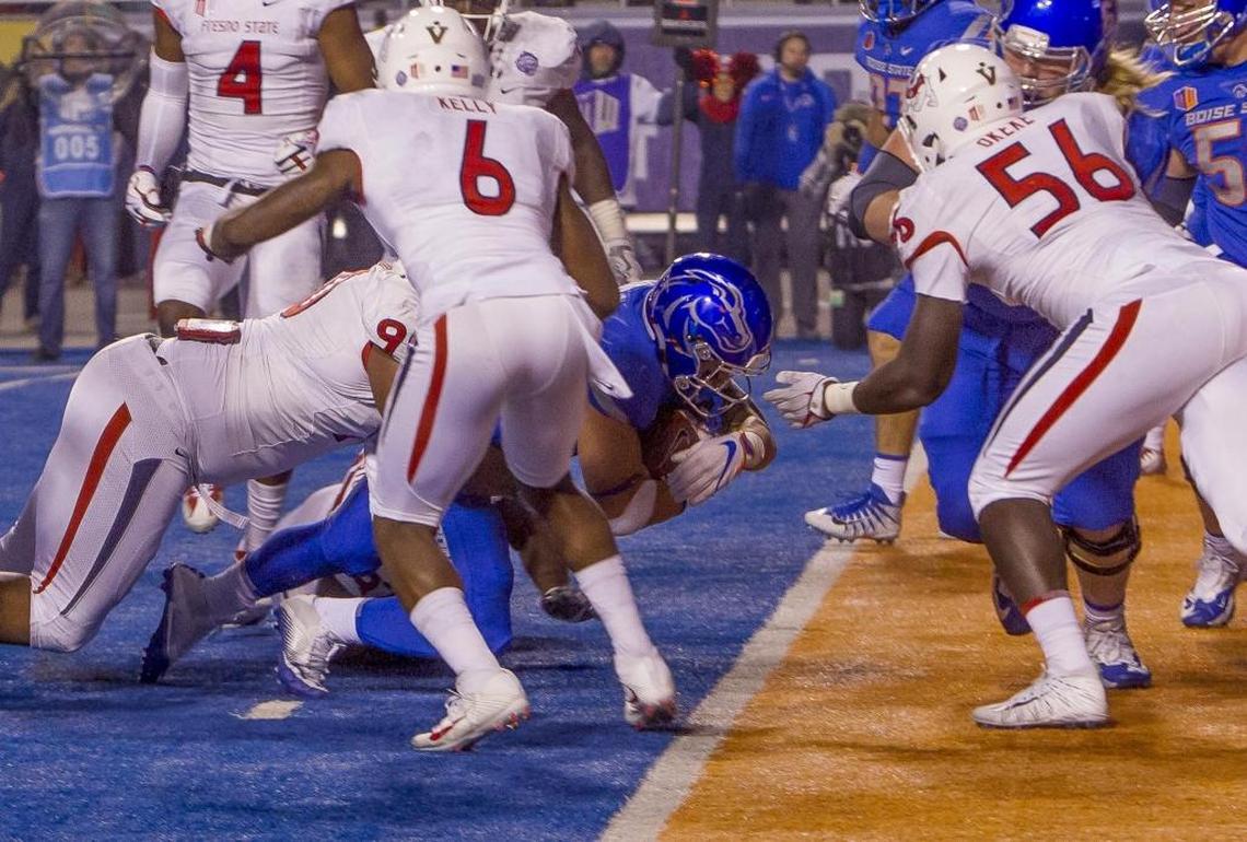 Boise State running back Ryan Wolpin plows across the goal line with the go-ahead score against Fresno State.
