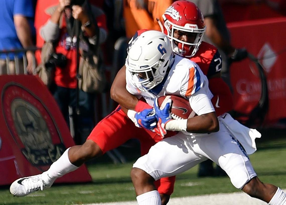 Fresno State safety Juju Hughes brings down Boise State wideout C.T. Thomas during the first half of the Bulldogs’ 28-17 victory Saturday, Nov. 25, 2017. Hughes was in on seven tackles in the game including five solo. He also was credited witth one pass breakup.