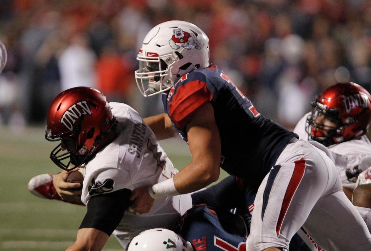 Fresno State linebacker George Helmuth and defensive end Tobenna Okeke take down UNLV quarterback Johnny Stanton at the goal line in the Bulldogs’ 26-16 loss last week. The Bulldogs allowed only 328 yards in the loss and has not allowed an opponent 400 yards or more since Washington had 420 on Sept. 16, 2017.