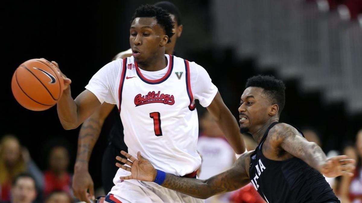 Fresno State point guard Jaron Hopkins steals the ball from Nevada's Marcus Marshall, right, leading the Bulldogs to a 77-76 victory over the Wolf Pack, Dec. 31, 2016 at the Save Mart Center. Hopkins led the Bulldogs in scoring last season, averaging 13.2 points per game. The 6-foot-6 senior also averaged 5.5 rebounds and 3.6 assists per game.