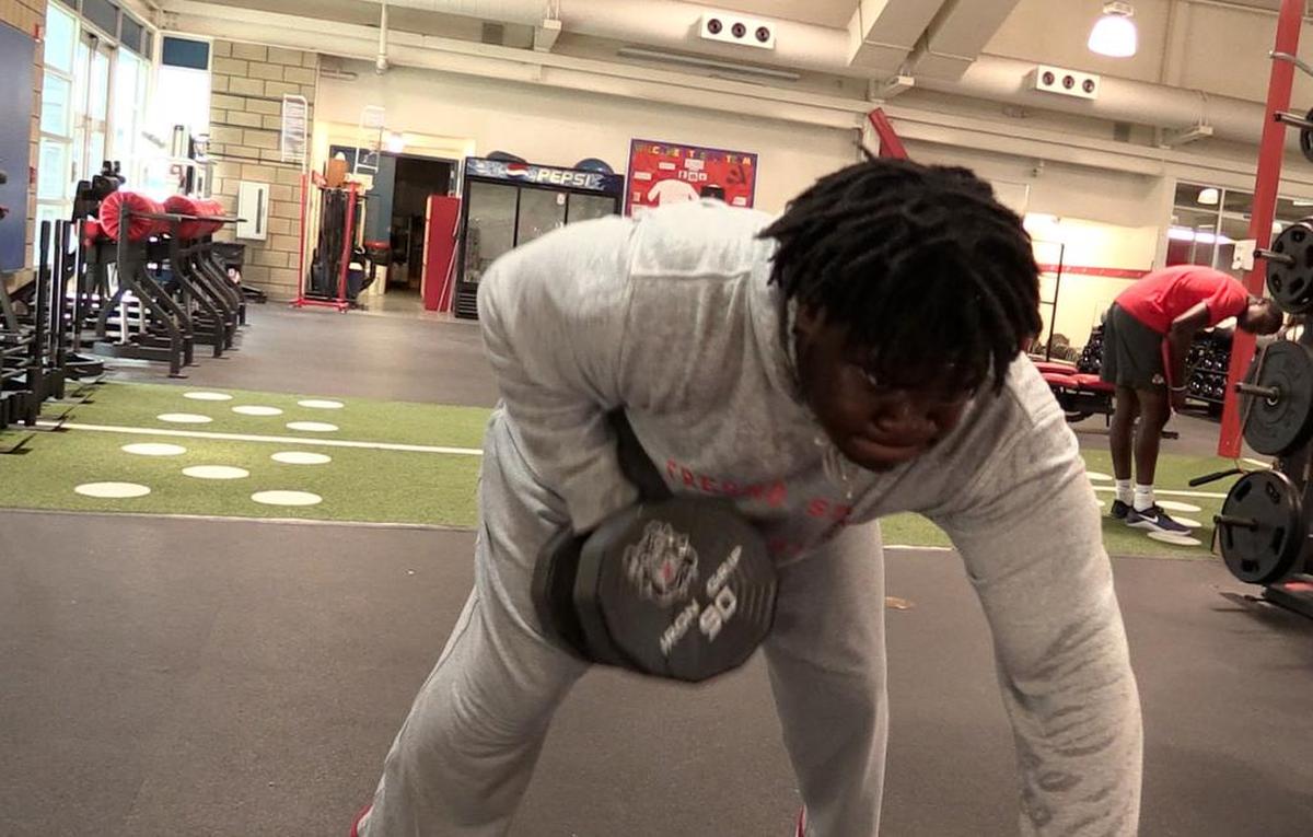 Defensive tackle Malik Forrester wears a jogging suit while lifting to help him lose weight. The 6-foot-1 senior said he dropped roughly 30 pounds in the offseason and enters this year weighing 295.