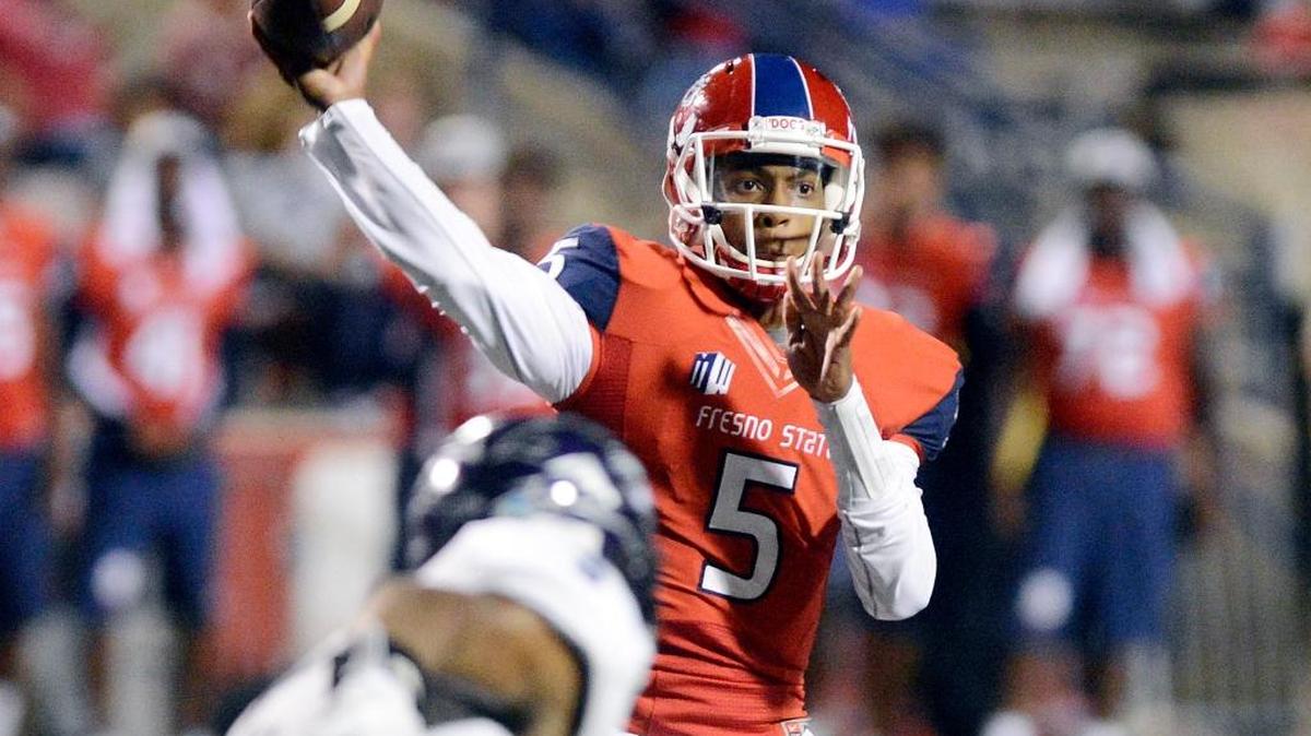 
Fresno State’s Chason Virgil shared time at quarterback with Zack Greenlee in the opener against Abilene Christian, with the pair combining to throw for four touchdowns but finishing 22-of-45 passing for 217 yards with two interceptions.
