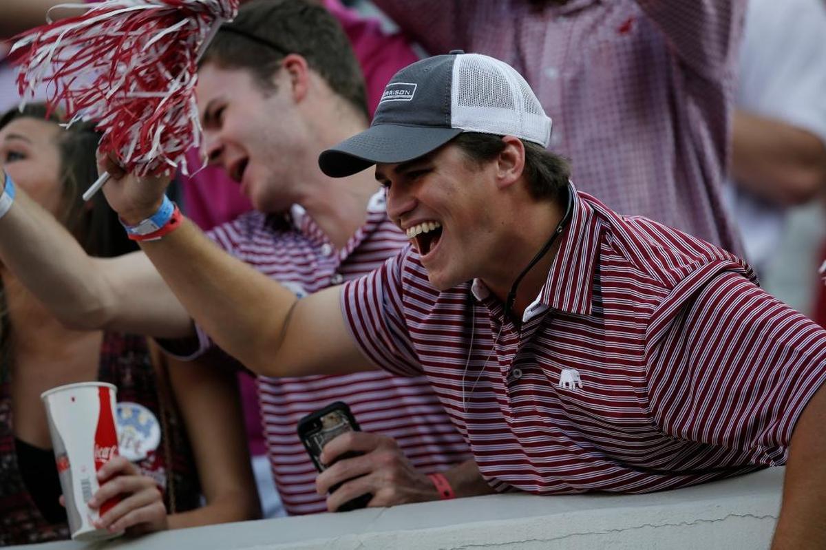 An Alabama fan celebrates after the No. 1-ranked Crimson Tide beat Fresno State 41-10 on Saturday, Sept. 9, 2017, in Tuscaloosa, Ala.