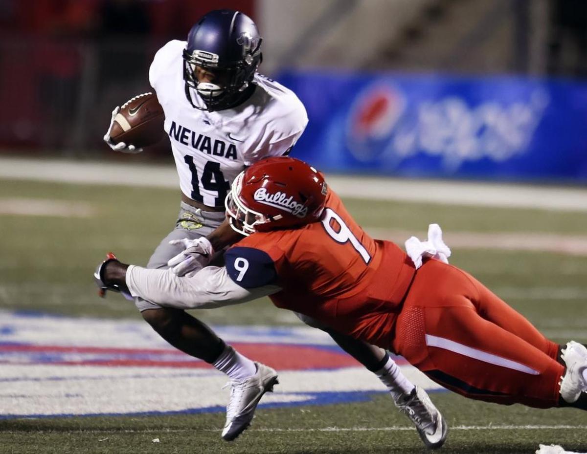 Fresno State linebacker Jeffrey Allison (9) tackles Nevada’s Mar’Quette Jackson (14) in the Bulldogs’ 41-21 victory over the Wolf Pack on Sept. 30, 2017, at Bulldog Stadium in Fresno. Allison, the defensive player in the week in the Mountain West Conference, is leading Fresno State with 58 tackles including 38 solo stops.