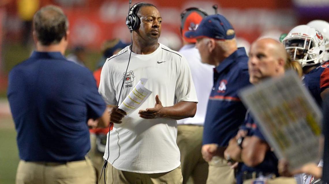 Fresno State defensive coordinator Lorenzo Ward, in white shirt on the sideline during the Bulldogs’ game against Sacramento State in September, says he’s in contact with recruits every week. After the firing of coach Tim DeRuyter on Oct. 23, 2016, some recruits are wavering on their oral commitments to the Bulldogs.