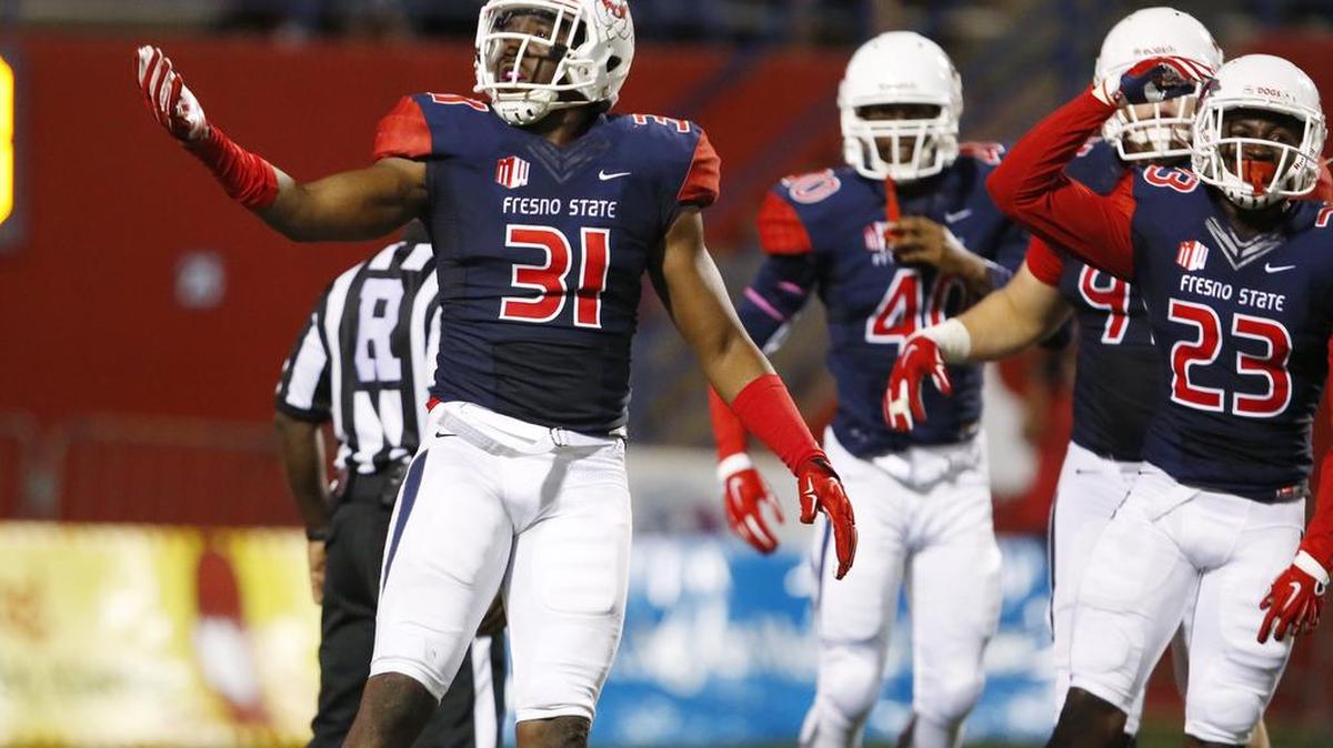 Fresno State’s Ejiro Ederaine celebrates a sack against UNLV during the first half of the Bulldogs’ victory Oct. 16, 2015. Ederaine, a senior linebacker, is closing in on the Mountain West record for career tackles for loss, with five games remaining in his career.