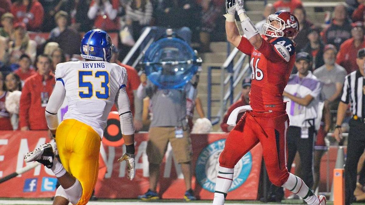 Fresno State’s Chad Olsen waits for the ball before catching a touchdown in front of San Jose State’s Isaiah Irving on Nov. 8, 2014, at Bulldog Stadium. The junior, who has 38 career catches for 463 yards and seven touchdowns, is dealing with what the program calls “personal issues” and is not expected to return to the program.