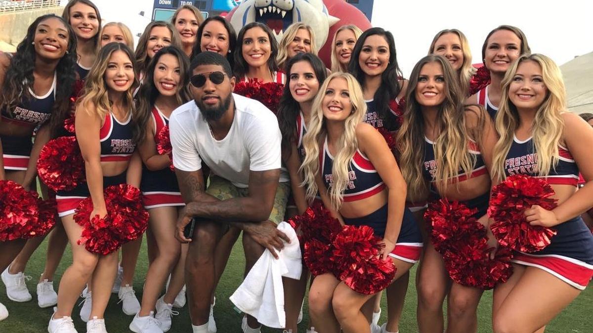 NBA star and former Fresno State standout Paul George poses with Bulldogs cheerleaders ahead of the school’s 2017 football opener against Incarnate Word.