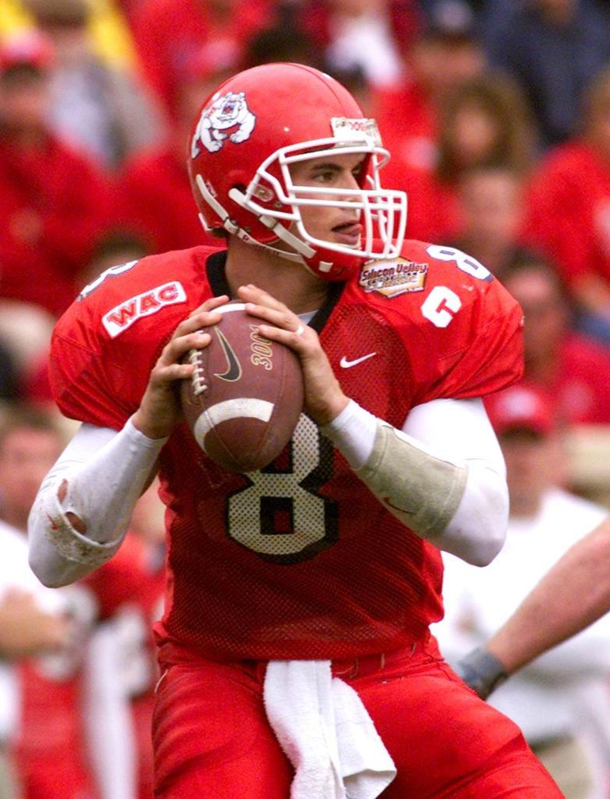 Fresno State quarterback David Carr prepares to pass in the second quarter of the Bulldogs’ game with Michigan State in the Silicon Valley Classic at Spartan Stadium Monday, December 31, 2001.