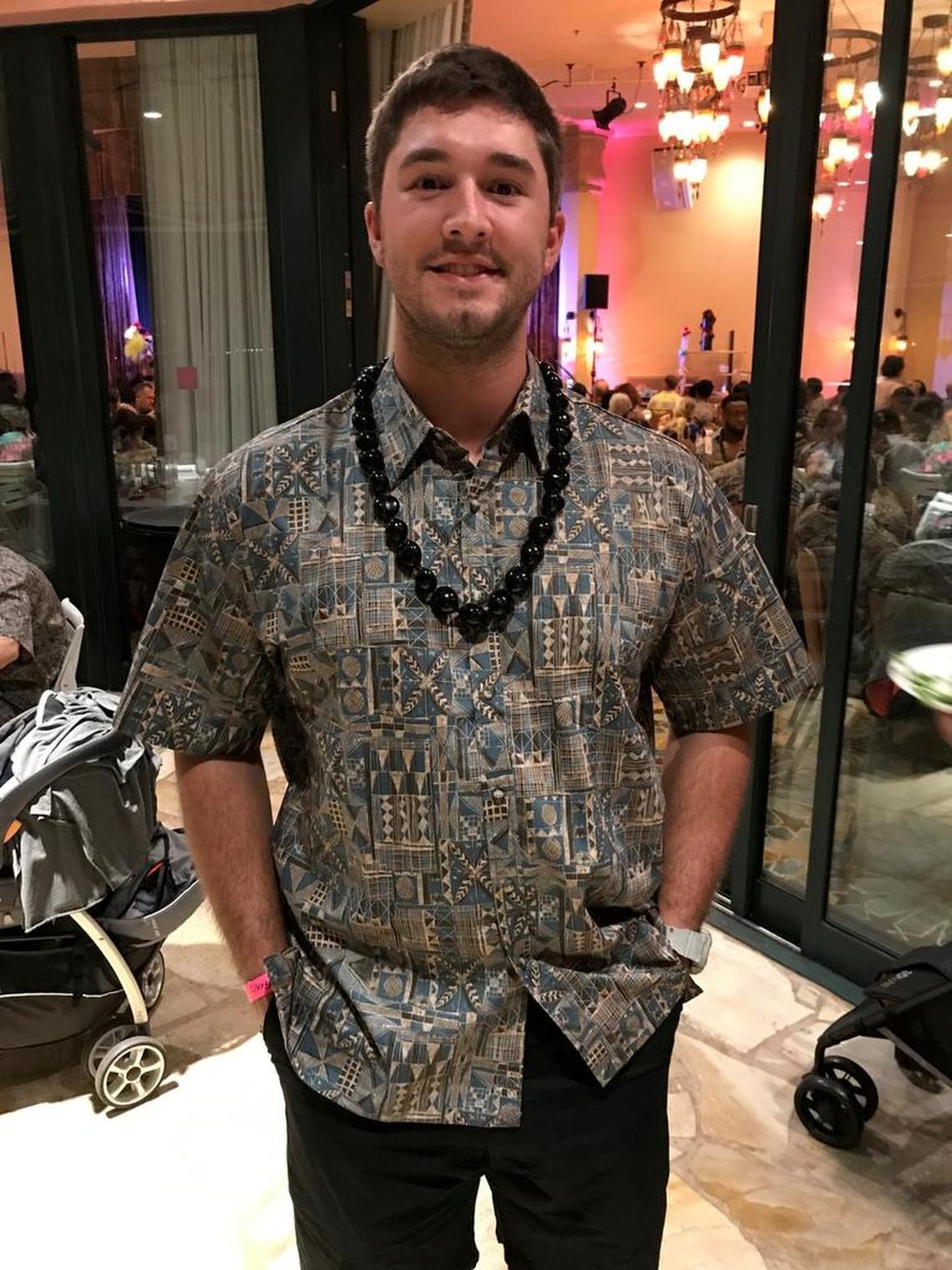 Offensive lineman Dylan Chmura models the Hawaiian shirt and necklace each Fresno State football player received as part of their Hawaii Bowl gifts.