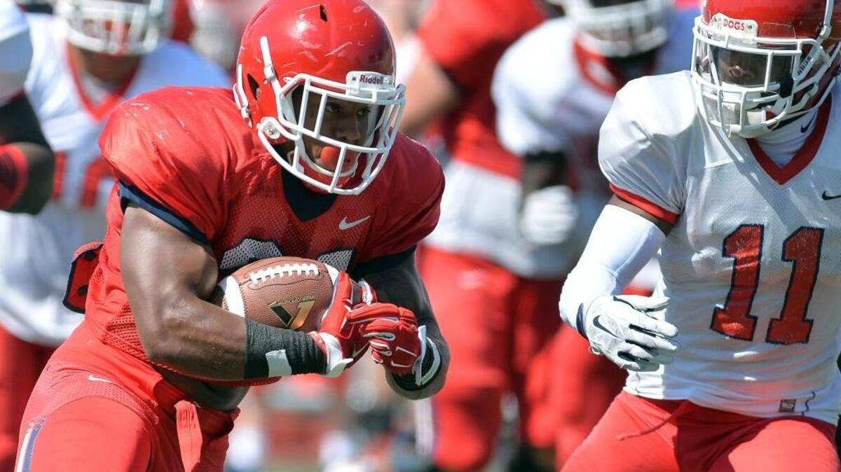 Fresno State running back Dontel James, left, trys to get around DeShawn Potts during the Spring Showcase scrimmage April 2, 2016. James injured a knee during fall camp but appears poised to play when the Bulldogs open the season Saturday at Nebraska.
