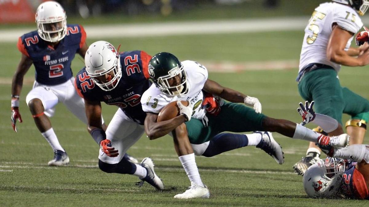 Fresno State’s Robert Stanley, left, and the rest of the defense have shown signs of significant improvement from last season. The Bulldogs rank second in the Mountain West Conference in total defense through two games, allowing 295.5 yards per game, in part by getting off the field on third down. Opponents have converted only 29.6 percent of their third downs into firsts.